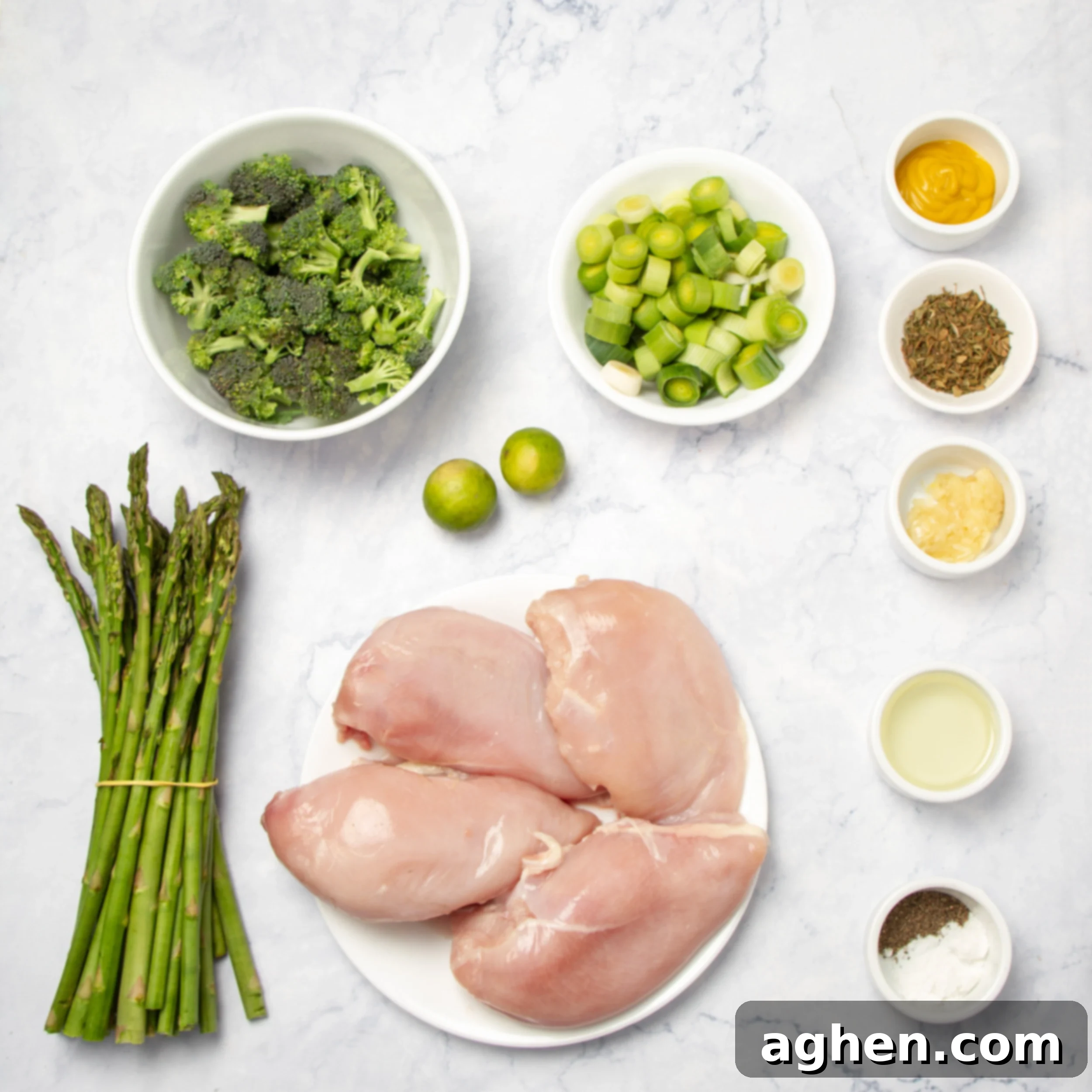 Ingredients for tarragon chicken with asparagus in a separate dishes. 