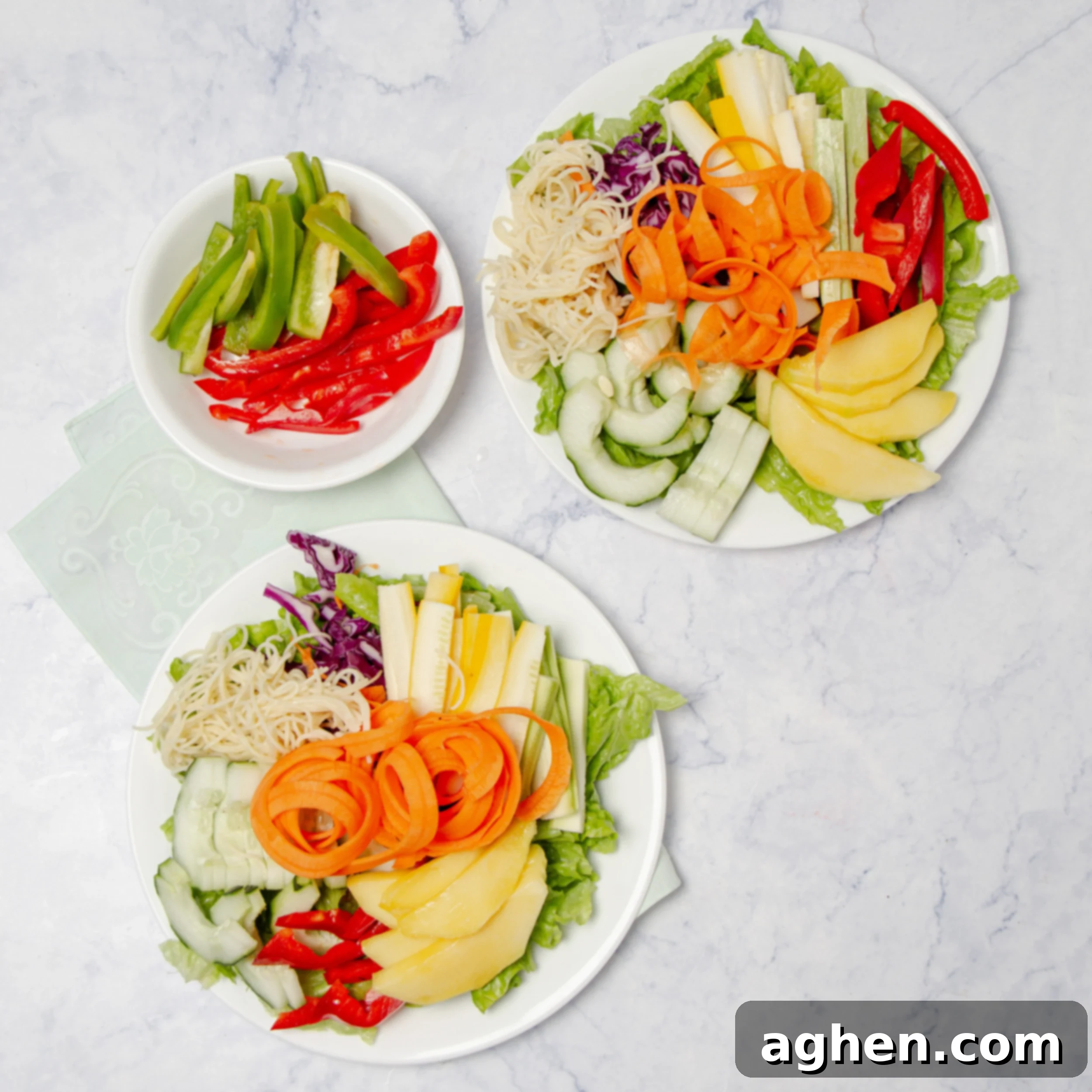 All fresh salad ingredients layered on a plate, meticulously arranged.