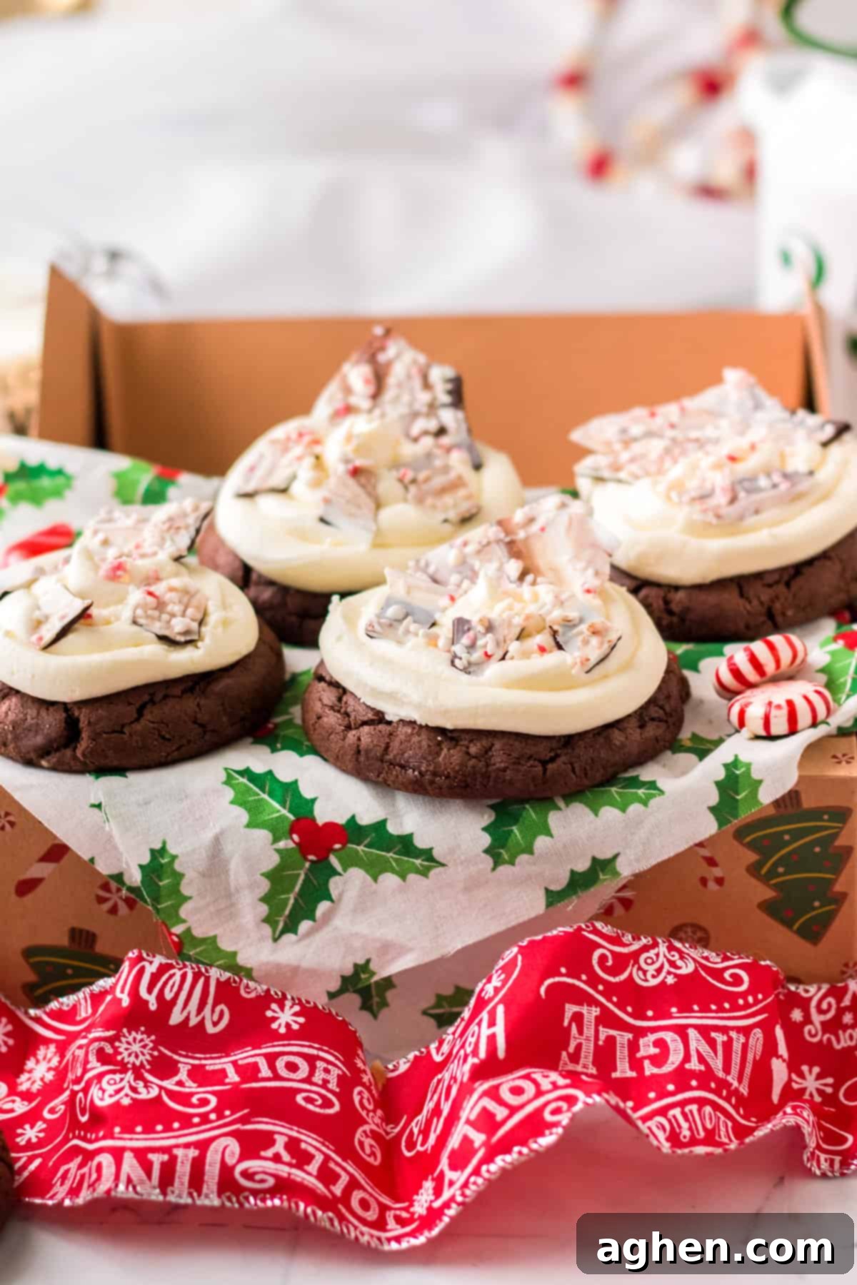 Collection of Double Chocolate Peppermint Bark Cookies with peppermint buttercream, beautifully arranged in a festive gift box lined with mistletoe tissue paper, perfect for holiday gifting.