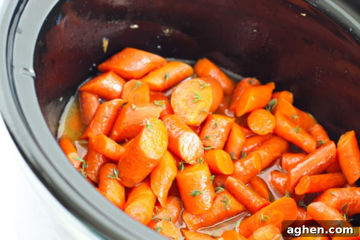 Glazed carrots simmering in the slow cooker.
