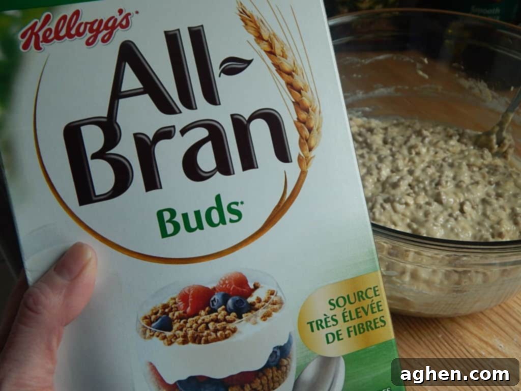 Mashed bananas and brown sugar mixed in a bowl, a key step for muffin batter.