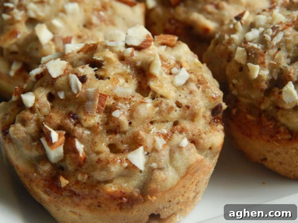 Drizzled honey-cinnamon topping and chopped almonds on unbaked muffin batter.
