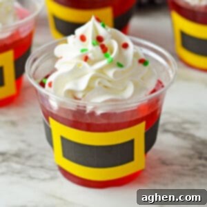 Jolly Santa Jello Cups 7 Santa jello cups with whipped cream and sprinkles.