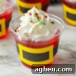 Jolly Santa Jello Cups 8 Santa jello cups with whipped cream and sprinkles.