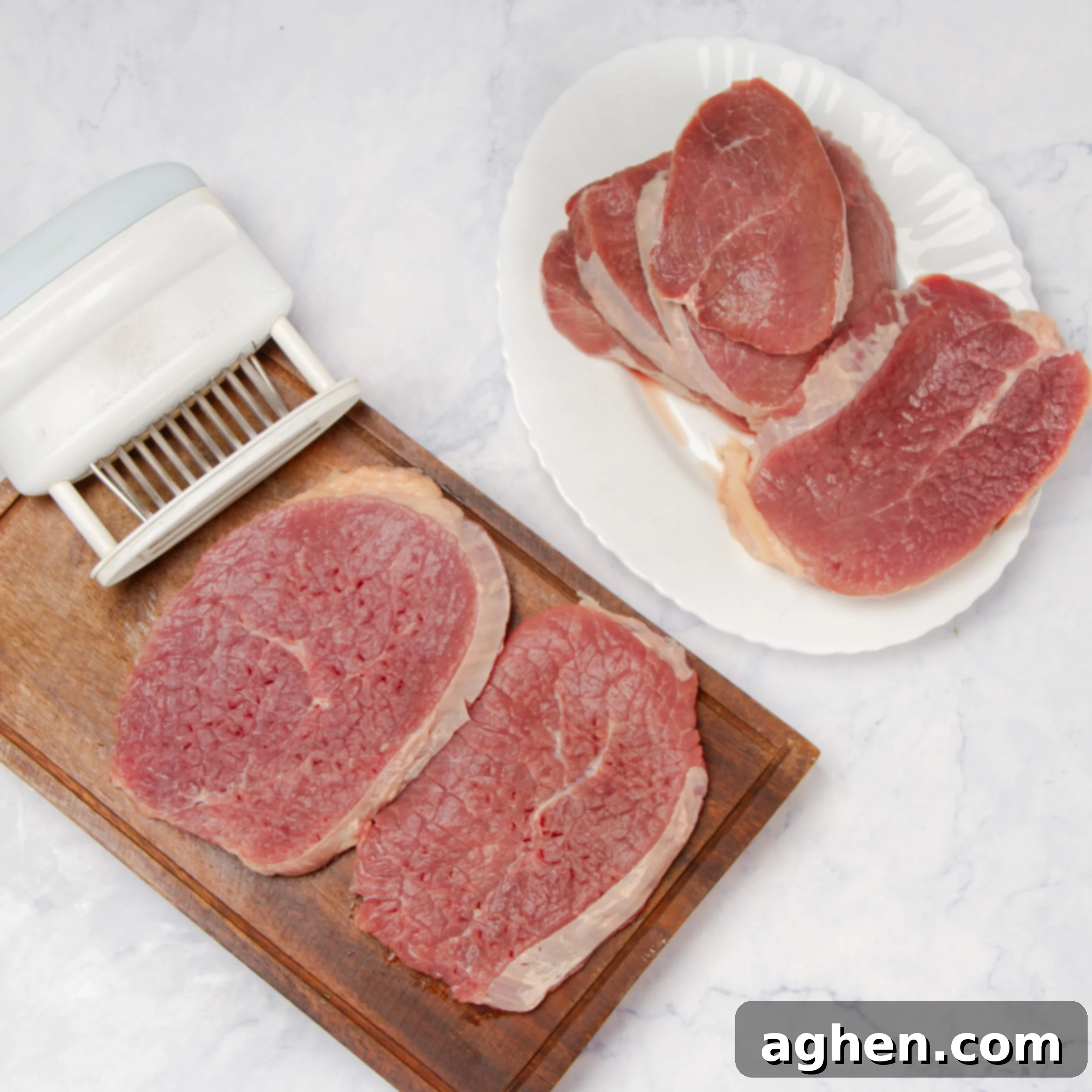Close-up of a hand tenderizing a slice of beef steak with a mallet on a cutting board, preparing it for a Swiss Steak recipe.