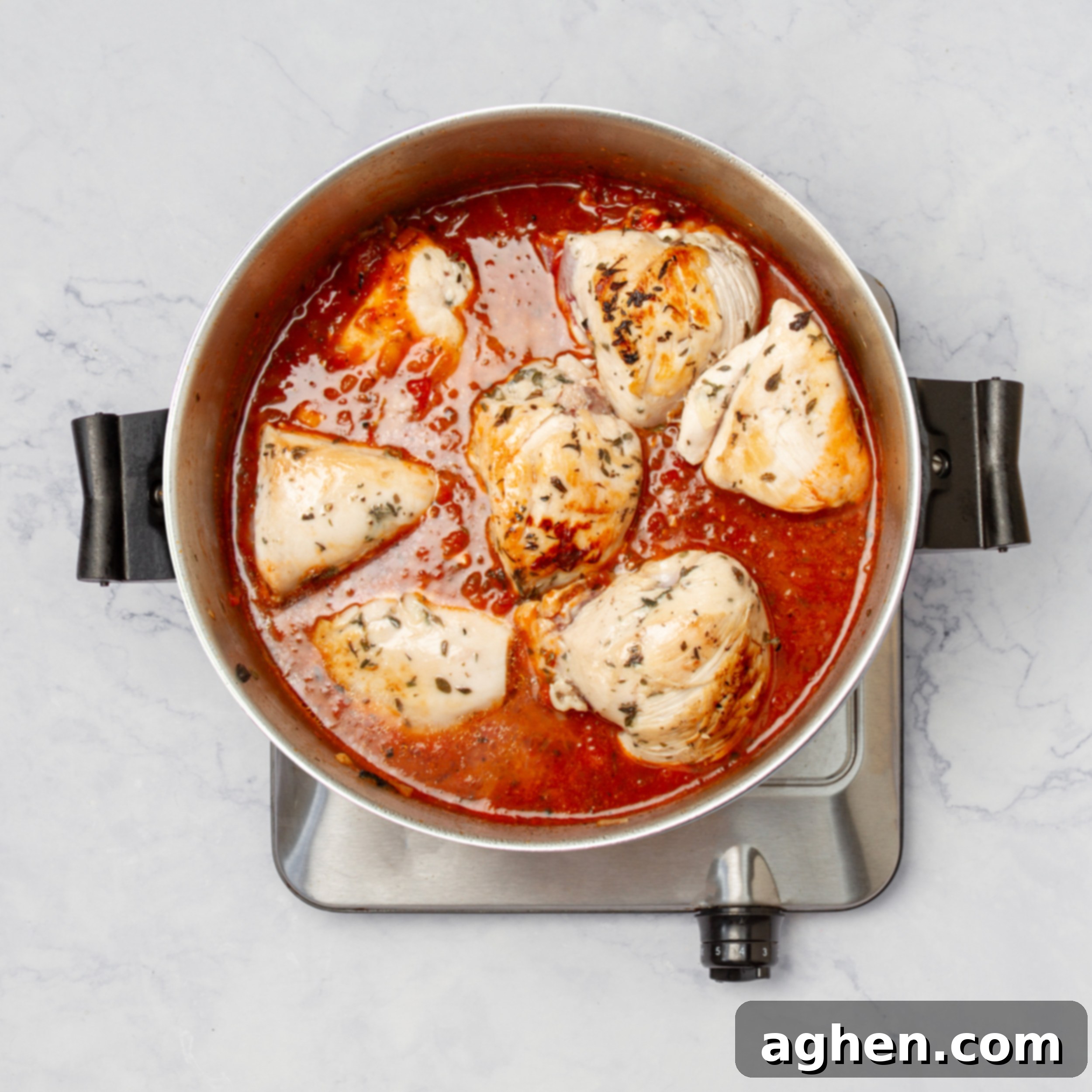 Weight Watchers' Favorite Chicken Caprese 6 Finishing cooking the chicken in the sauce.