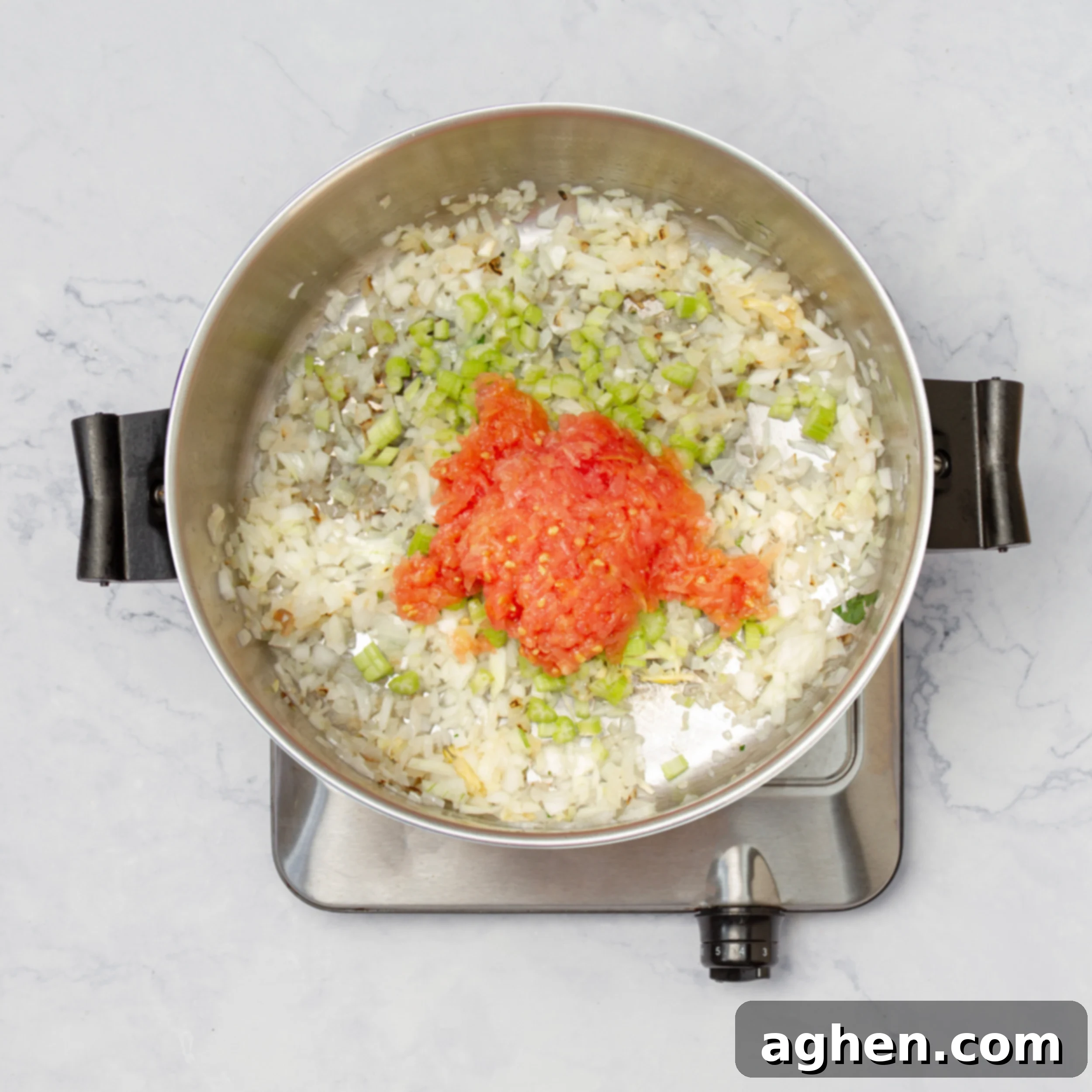 Hearty Black Eyed Pea Delight 4 Aromatics sauteing in a pan.