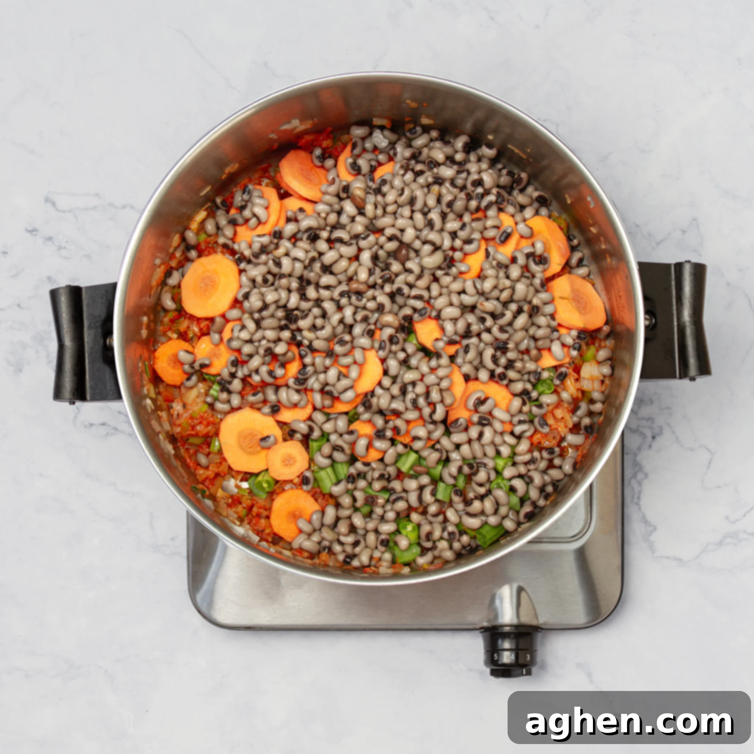 Hearty Black Eyed Pea Delight 5 Vegetables and black-eyed peas added to the sautéed soup base.