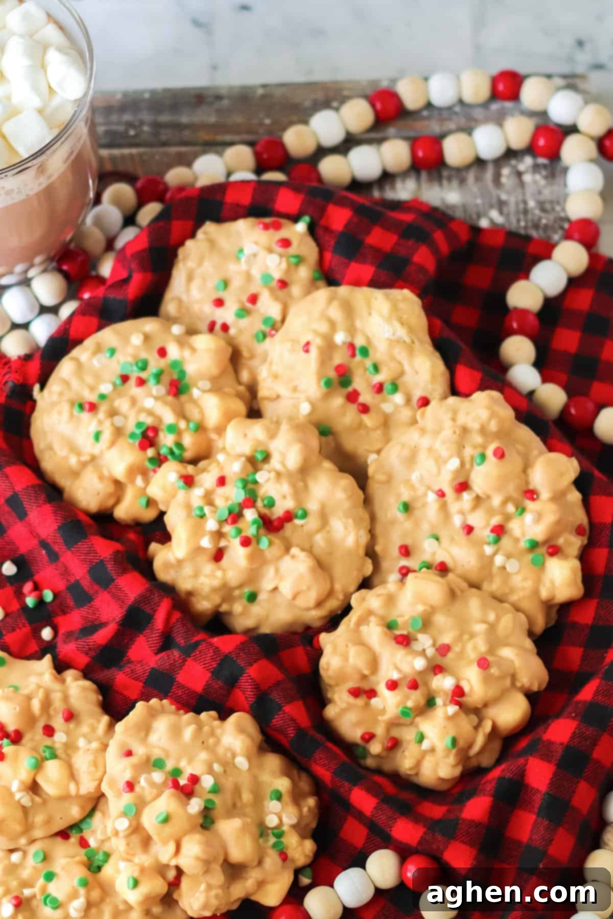 No bake avalanche cookies topped with holiday mini chips and placed in a napkin-lined Christmas cookie tin.