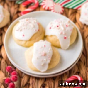 Peppermint meltaway cookies; pale, round cookies topped with icing and crushed peppermint candies.
