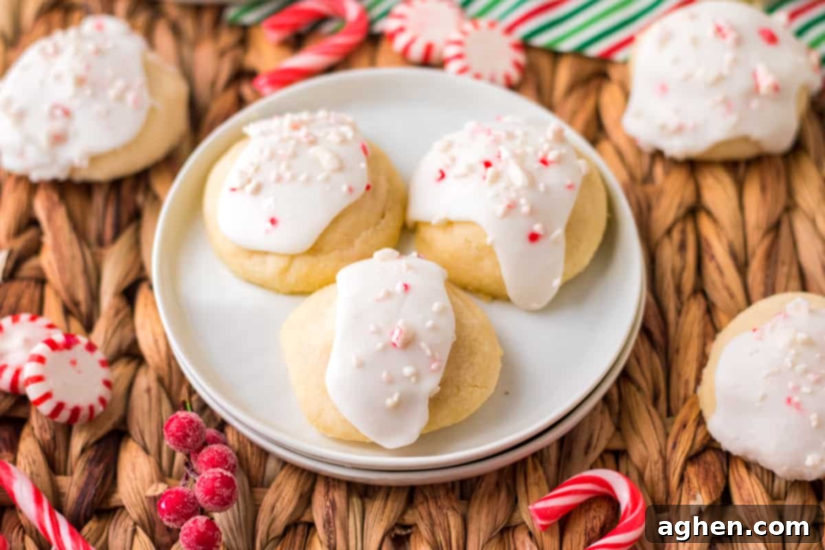 Peppermint meltaway cookies with glaze and crushed peppermint on top, arranged enticingly for a closer look.
