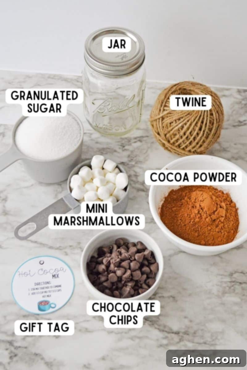 Ingredients and supplies for hot cocoa mix in a jar, including cocoa powder, sugar, salt, chocolate chips, and marshmallows.