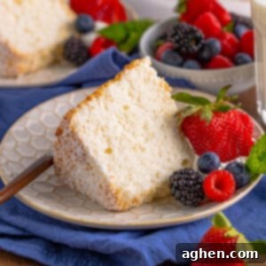 Angel food cake slice served with fresh berries.