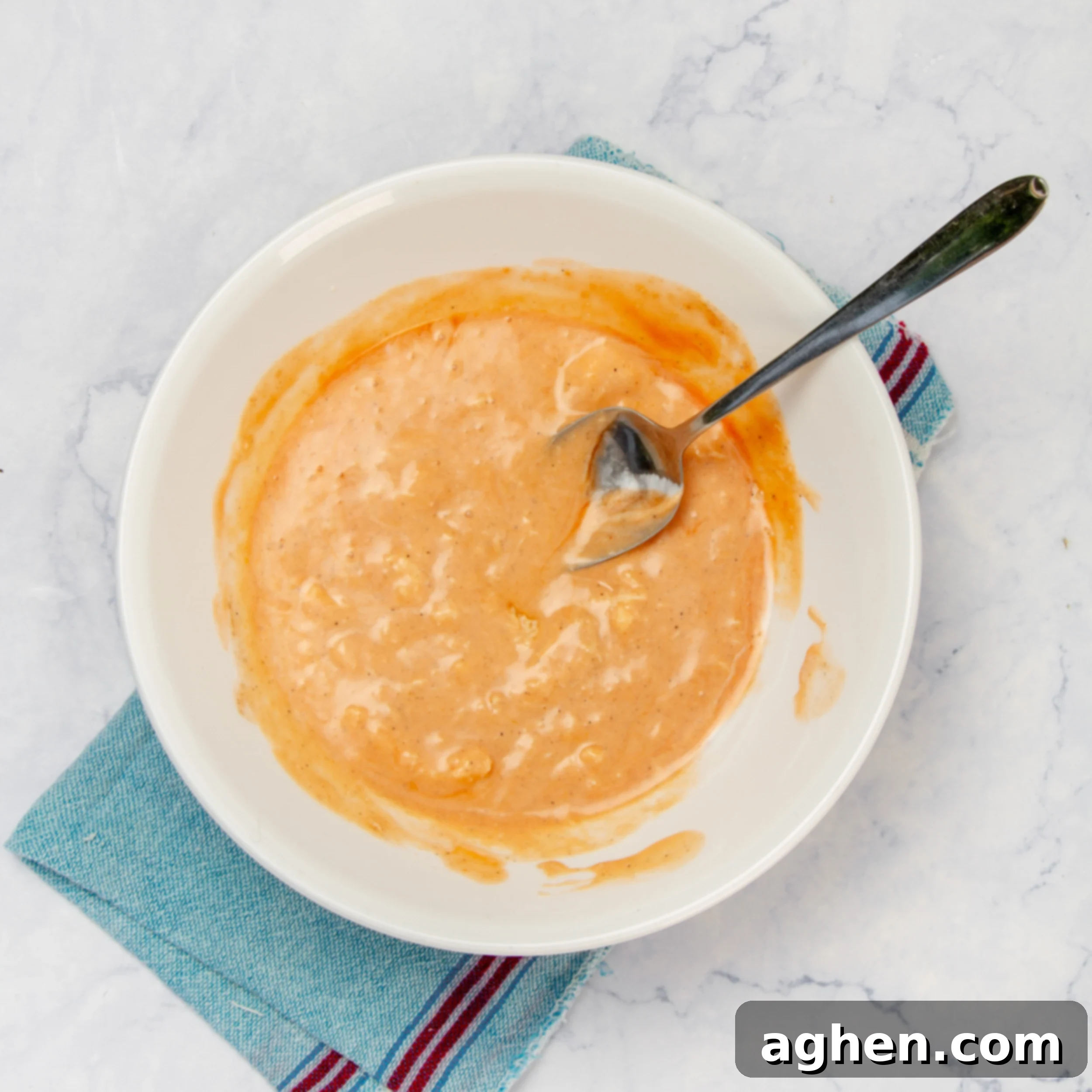 Deliciously Diet-Friendly Weight Watchers Buffalo Chicken Salad 4 Combine the sauce ingredients in a small bowl, showing yogurt and buffalo sauce being whisked together.