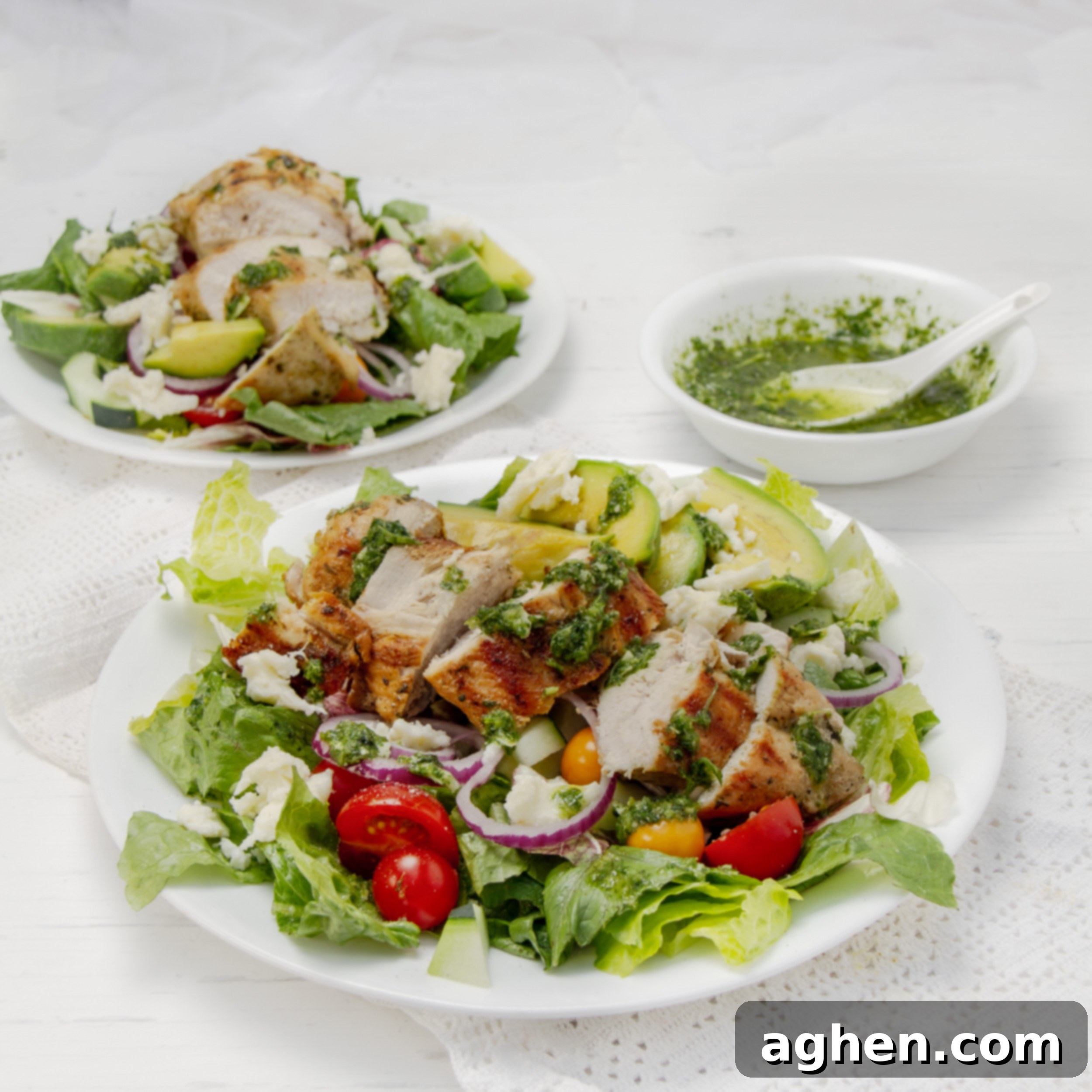 Pesto Chicken with Creamy Avocado 2 Healthy and vibrant Pesto Chicken and Avocado on a plate.