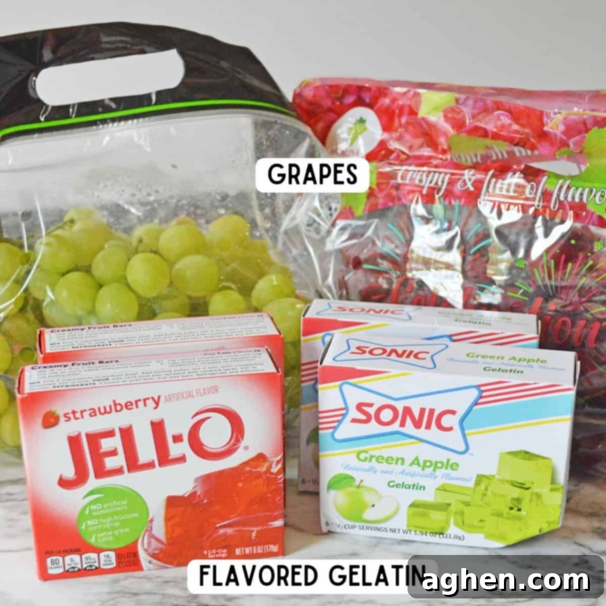 Bag of green grapes, bag of red grapes, strawberry jello mix, and Sonic green apple gelatin.