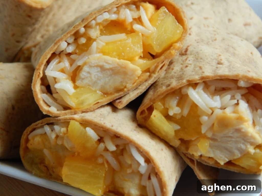 Finished Pineapple Chicken and Rice Wraps, cut in half