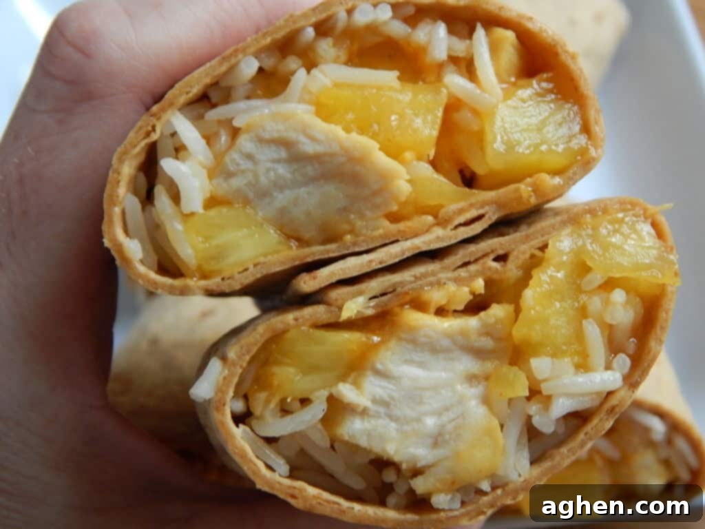 Rolling a pineapple chicken and rice Flatout wrap
