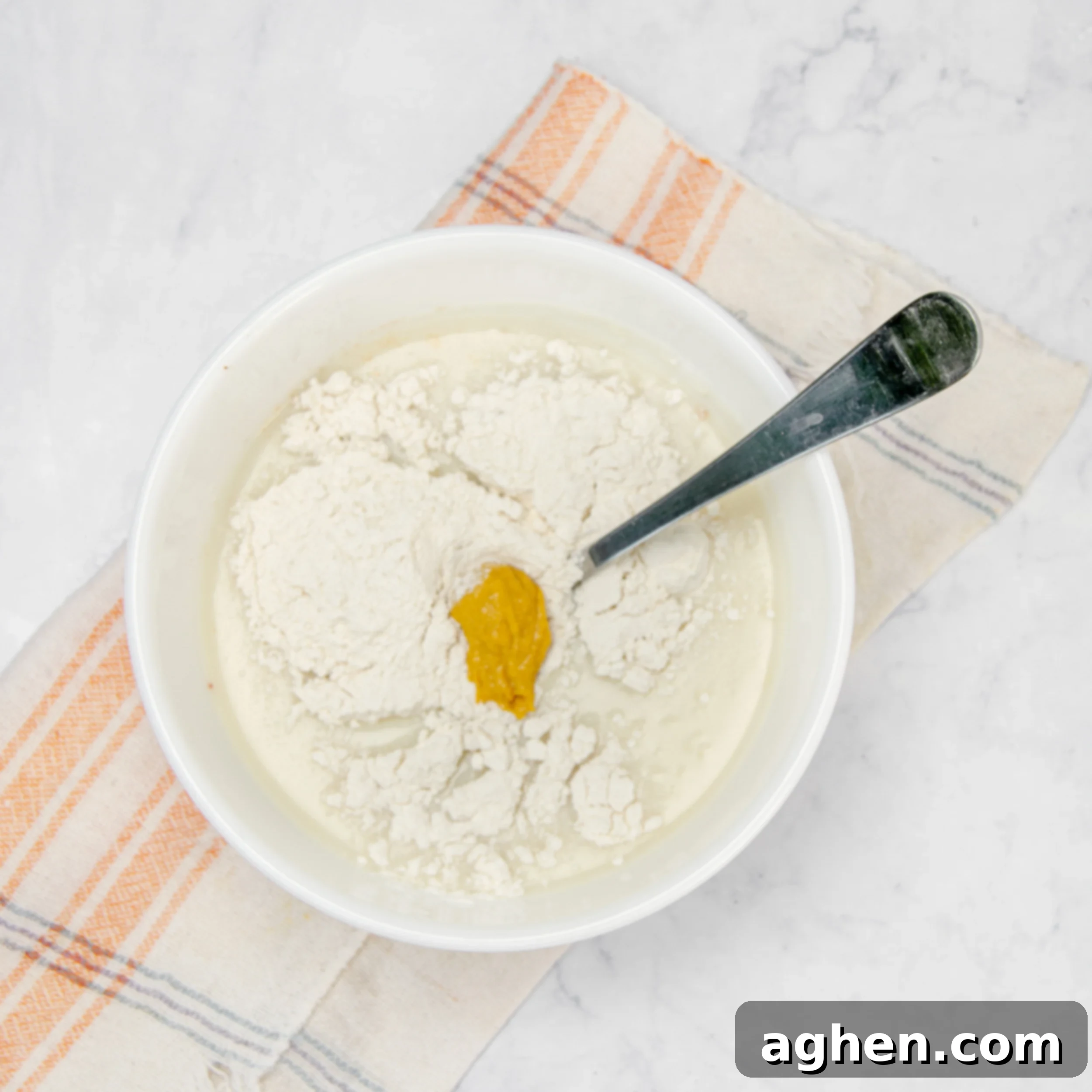 Ingredients for the creamy base mixed in a small bowl—mise en place, showing careful preparation.