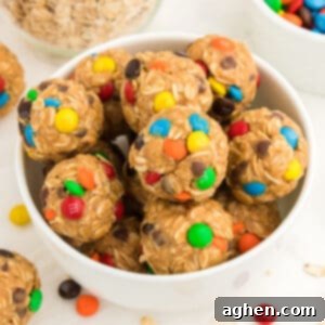 Monster Energy Balls with oats, mini M&Ms, chocolate chips, peanut butter, and honey.