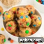 Monster Energy Balls with oats, mini M&Ms, chocolate chips, peanut butter, and honey.