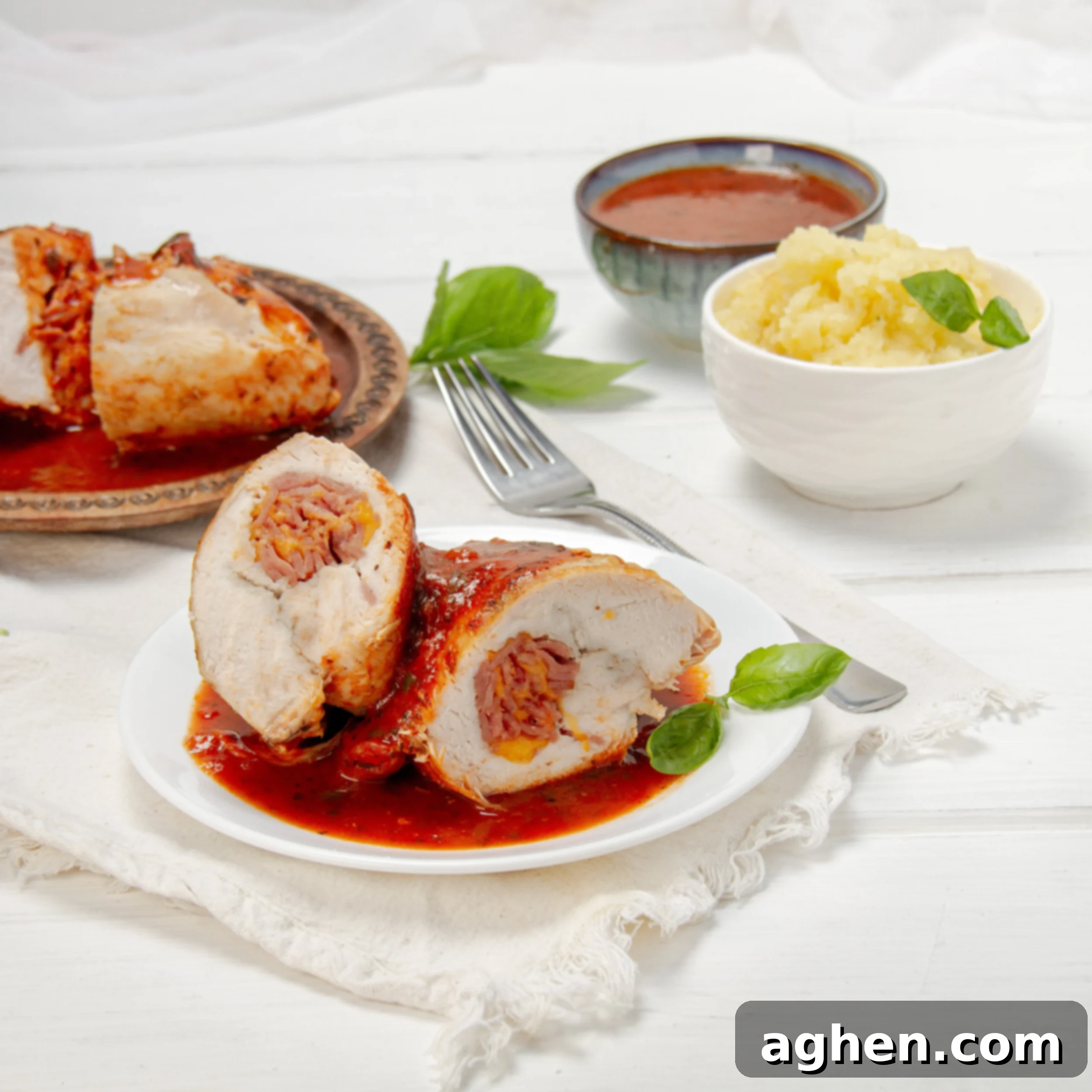 Elegant Stuffed Chicken Breast 2 Light, juicy, and stuffed with goodness—saucy Chicken Rollatini on a plate.