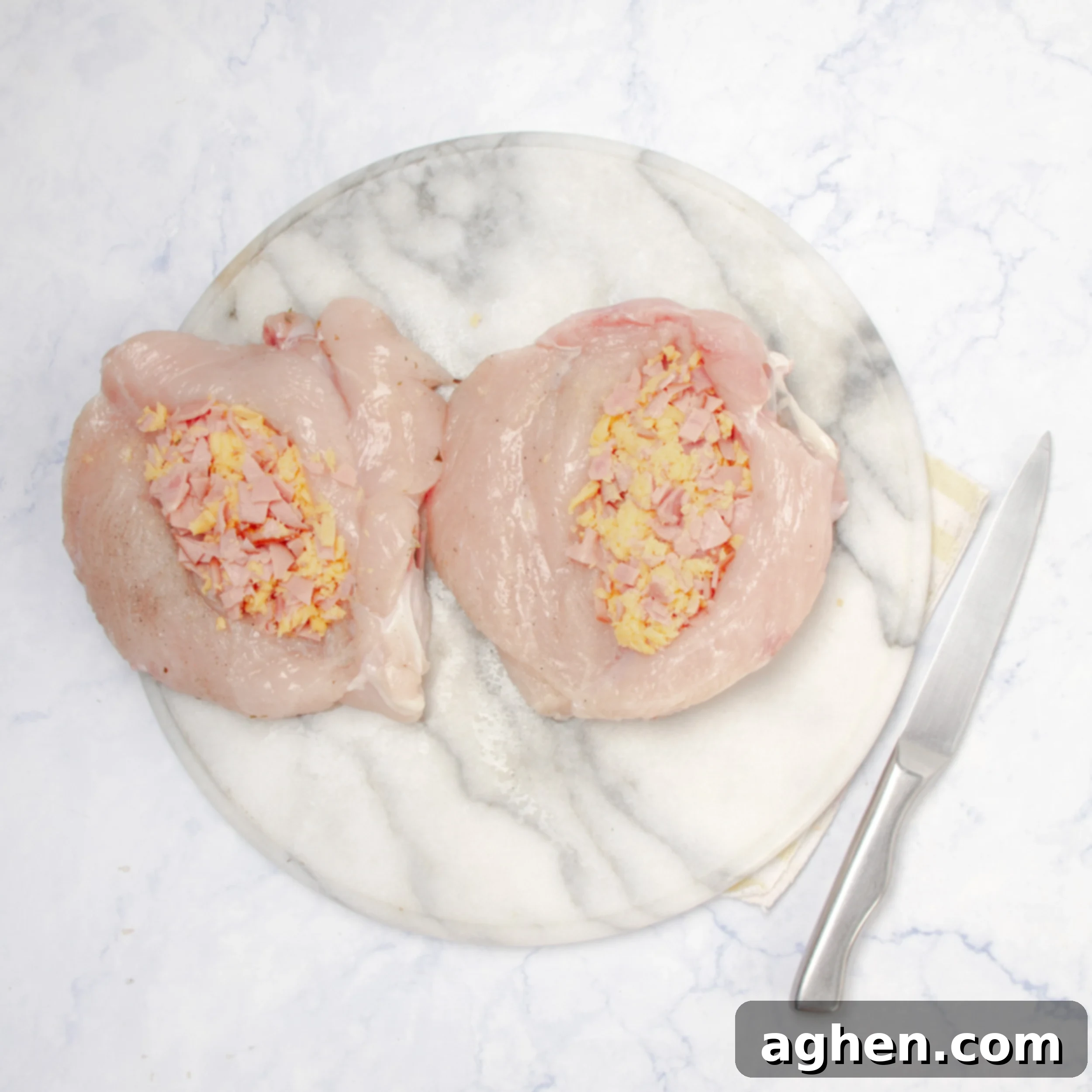Elegant Stuffed Chicken Breast 4 Raw chicken breasts slit open and stuffed with the garlicky meat and herb filling.