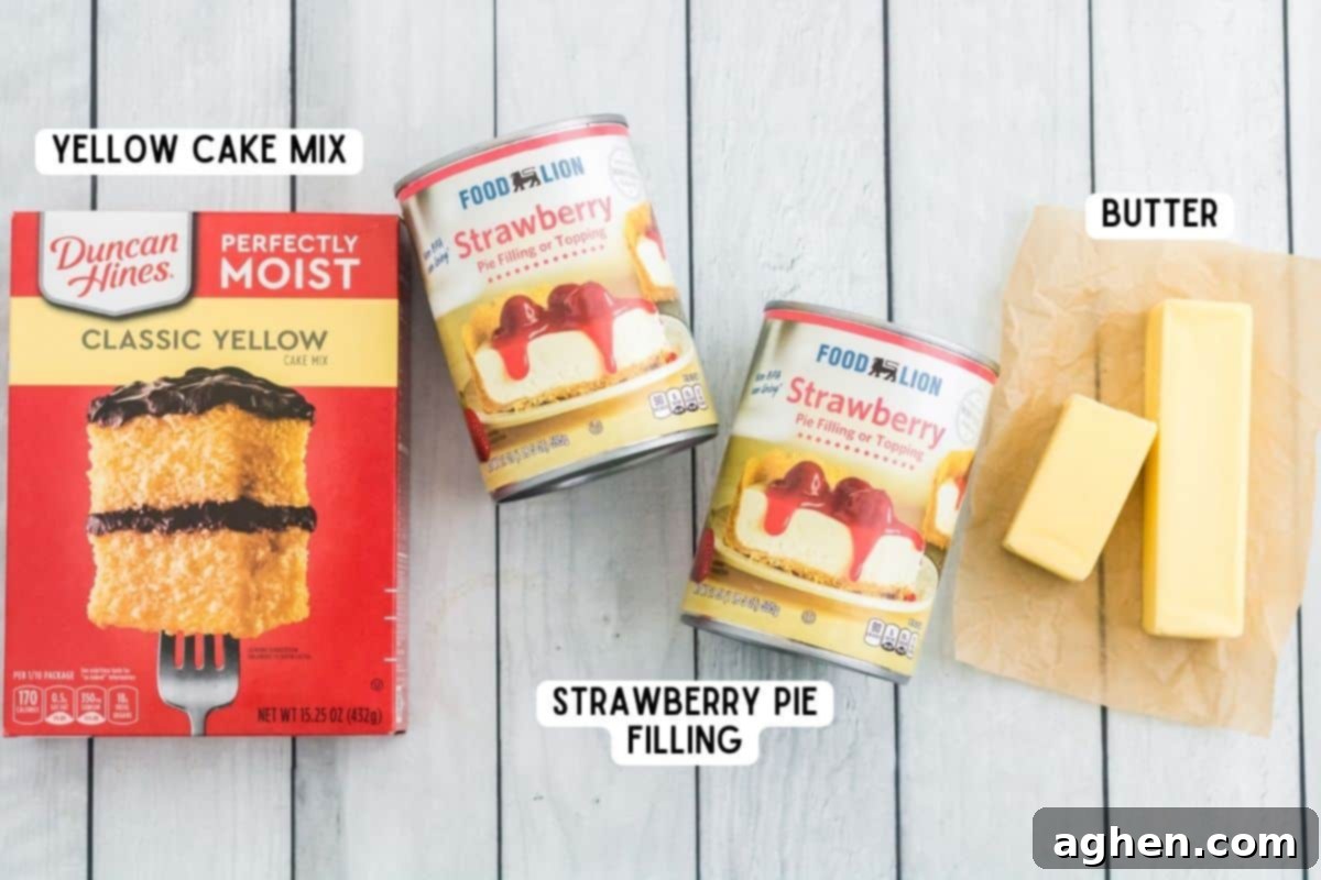 Three key ingredients for Strawberry Dump Cake: a box of yellow cake mix, two cans of vibrant strawberry pie filling, and one and a half sticks of butter, neatly arranged for preparation.