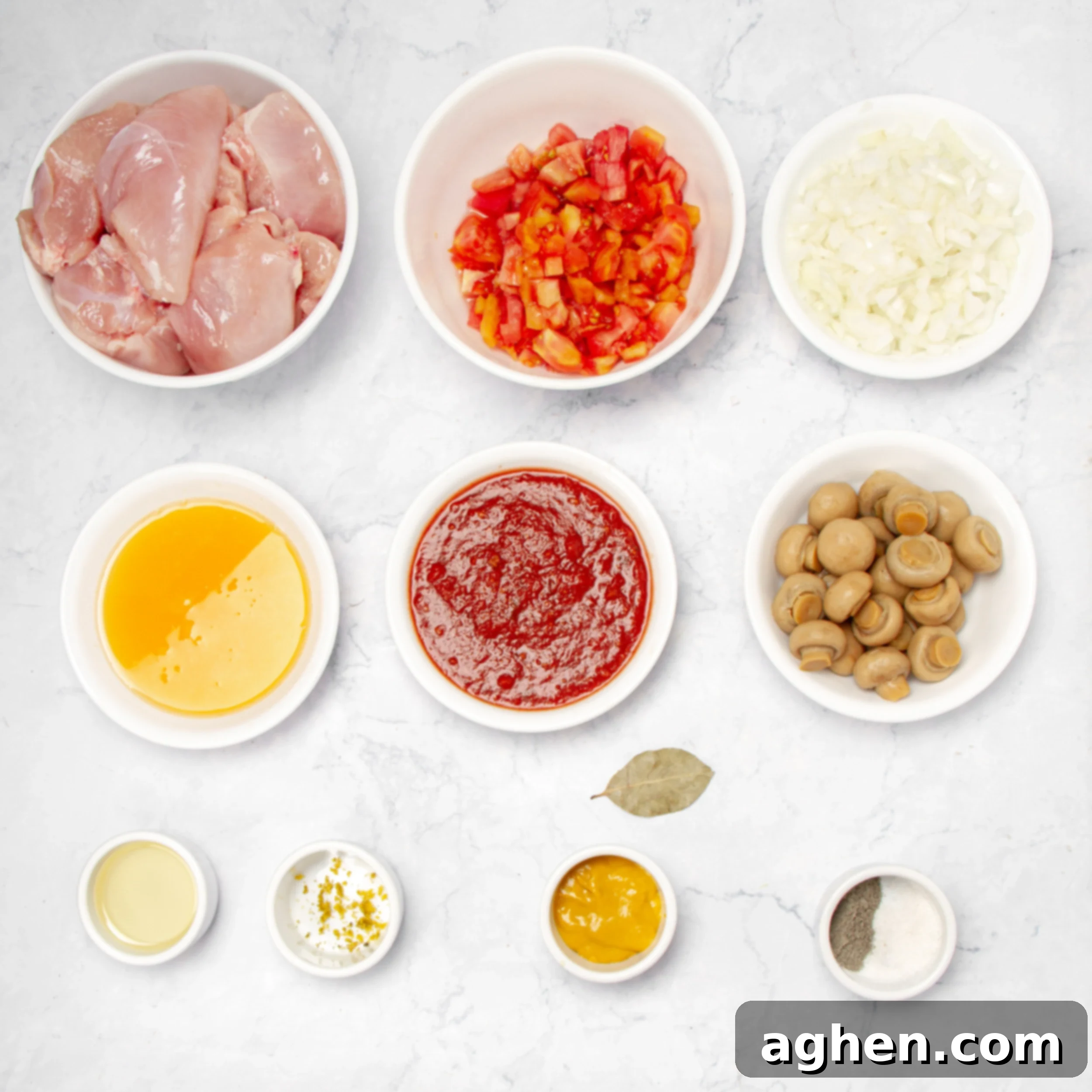 Napoleonic Chicken 3 A vibrant display of fresh ingredients for a healthy Chicken Marengo, including neatly arranged chicken pieces, ripe tomatoes, diced onions, canned mushrooms, and a bottle of orange juice, all prepped in separate dishes.