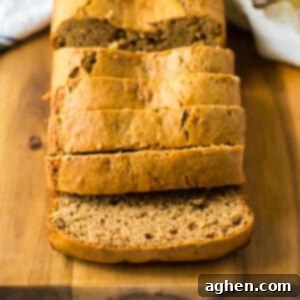 The best easy banana bread on a cutting board and cut into slices.