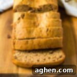 The best easy banana bread on a cutting board and cut into slices.