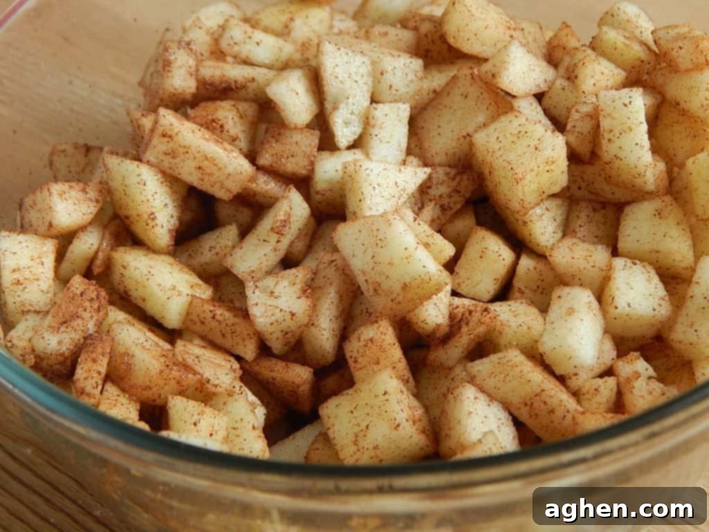 Pillsbury Biscuits: The Unexpected Star of Apple Cinnamon Crumble 6 Pillsbury Biscuits Apple Cinnamon Crumble with a spoon taken out