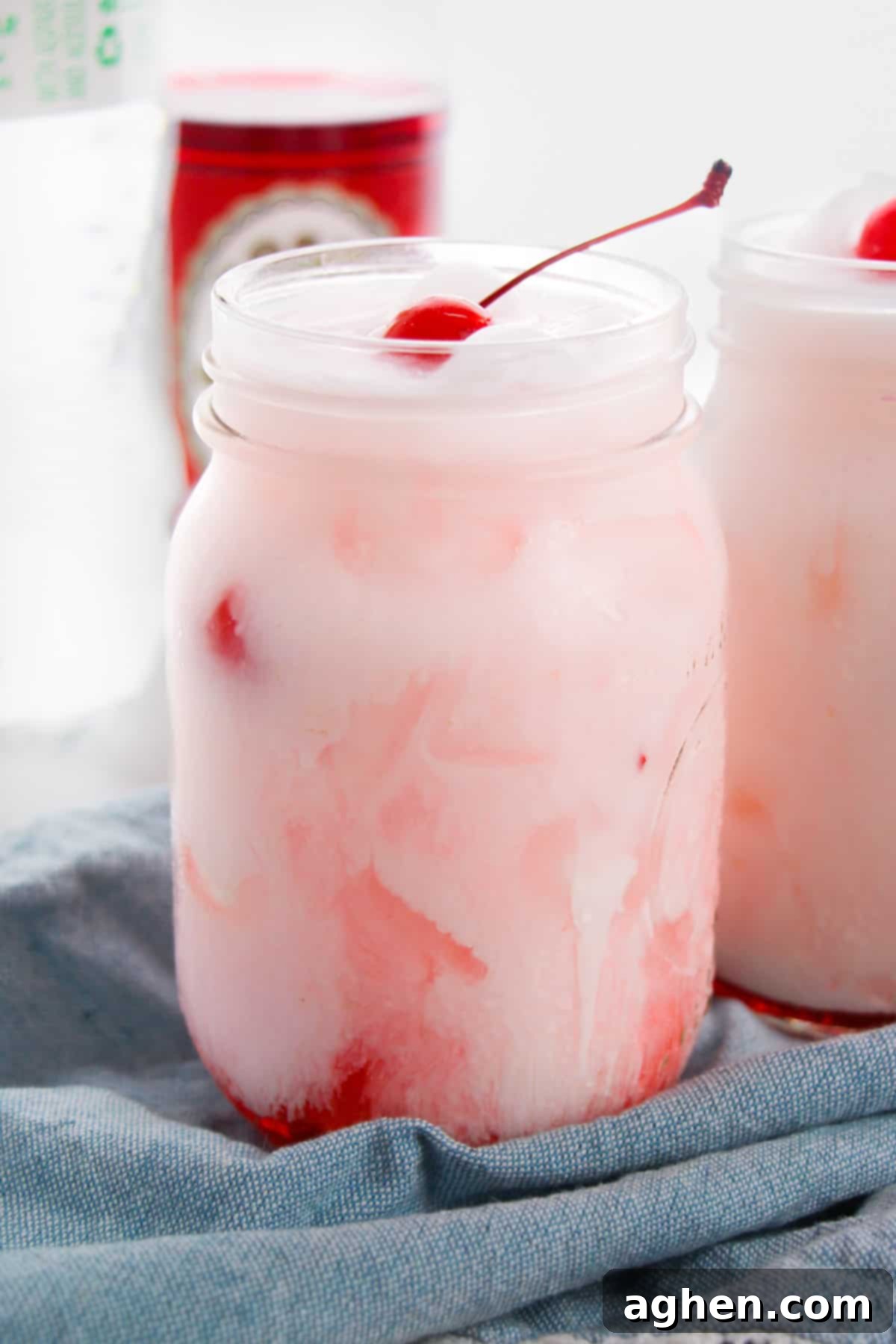 Shirley temple dirty soda with Sprite, grenadine, creamer, and maraschino cherry.