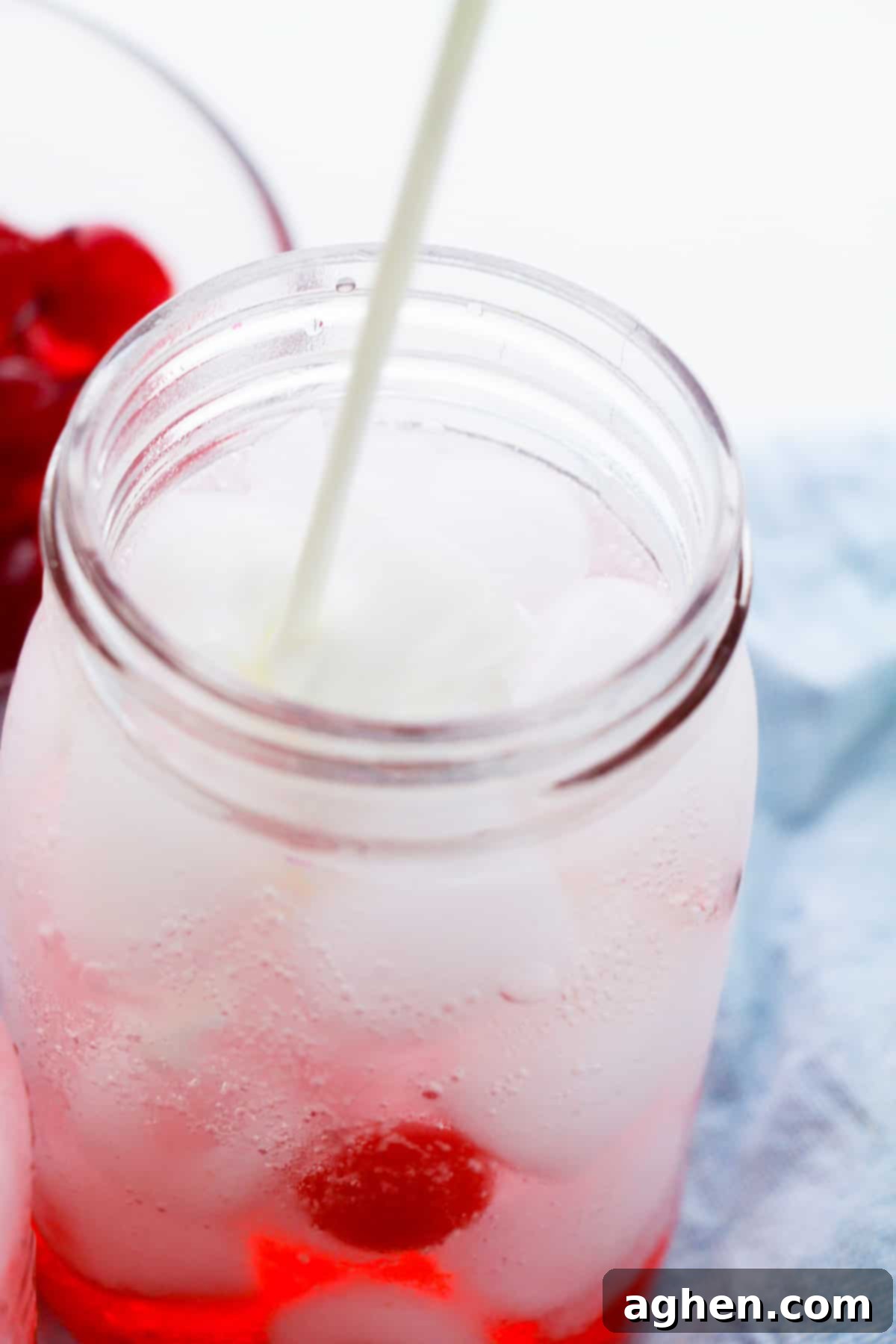 Creamer being poured into mason jar.