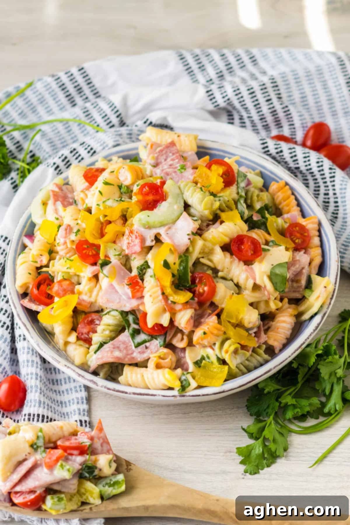 Italian sub pasta salad with cold meats, fresh veggies, and tri color rotini.
