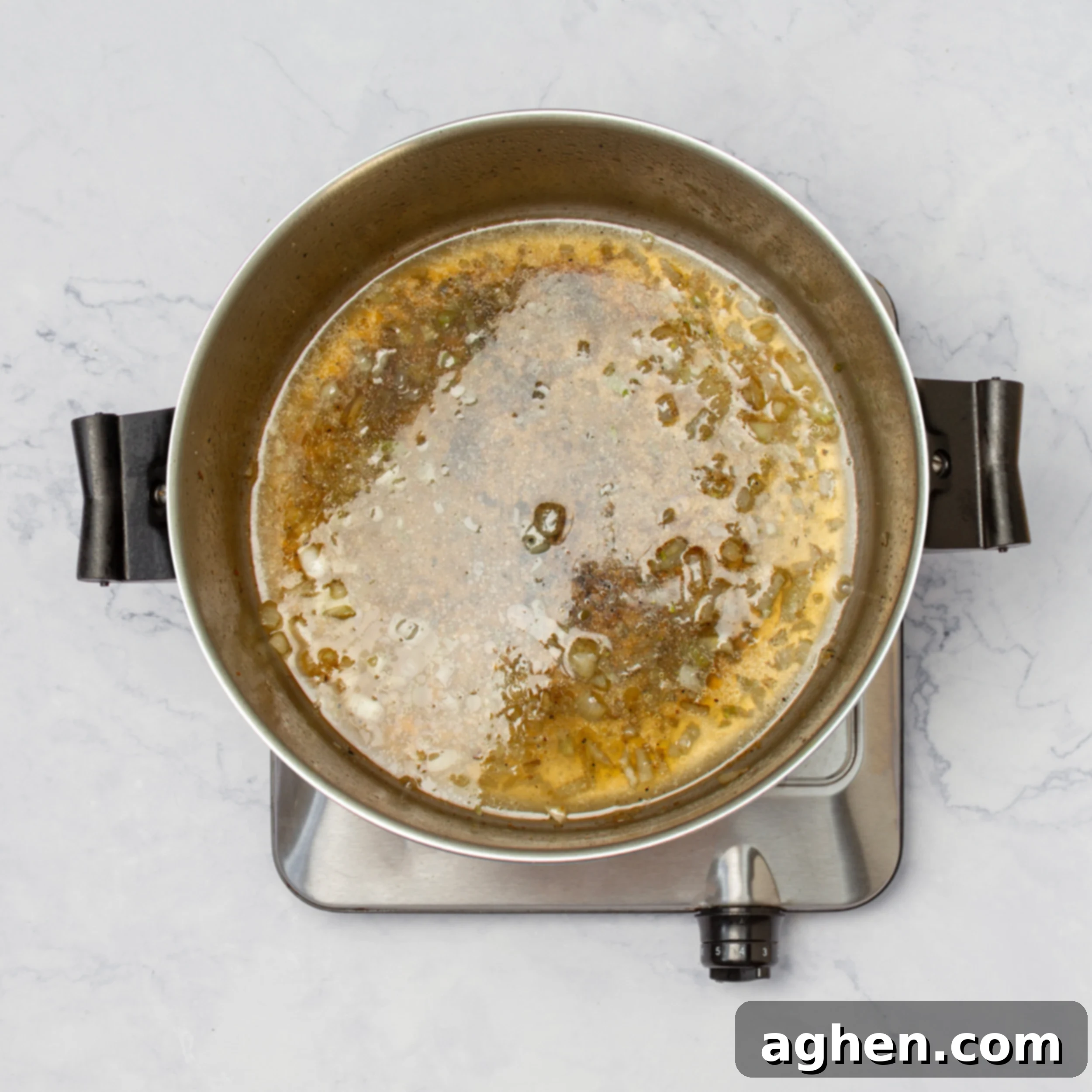 Tropical Coconut Lime Chicken 5 Sauce ingredients simmering in a pan, creating a rich and fragrant base.