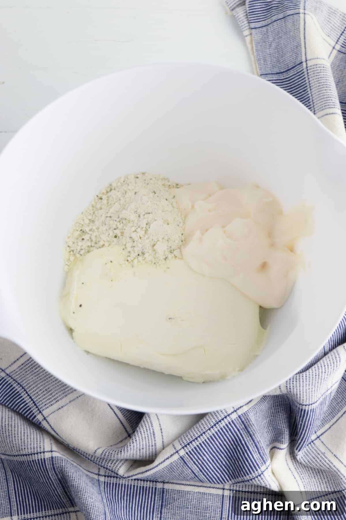 Creamy Ranch BLT Swirls 3 Ranch mix, cream cheese, and mayo in mixing bowl, ready to be combined.