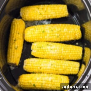 Effortless Slow Cooker Corn 9 Slow cooker corn on the cob with butter and seasonings.