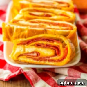Pepperoni bread with frozen bread dough and mozzarella cheese sliced and on a white plate.