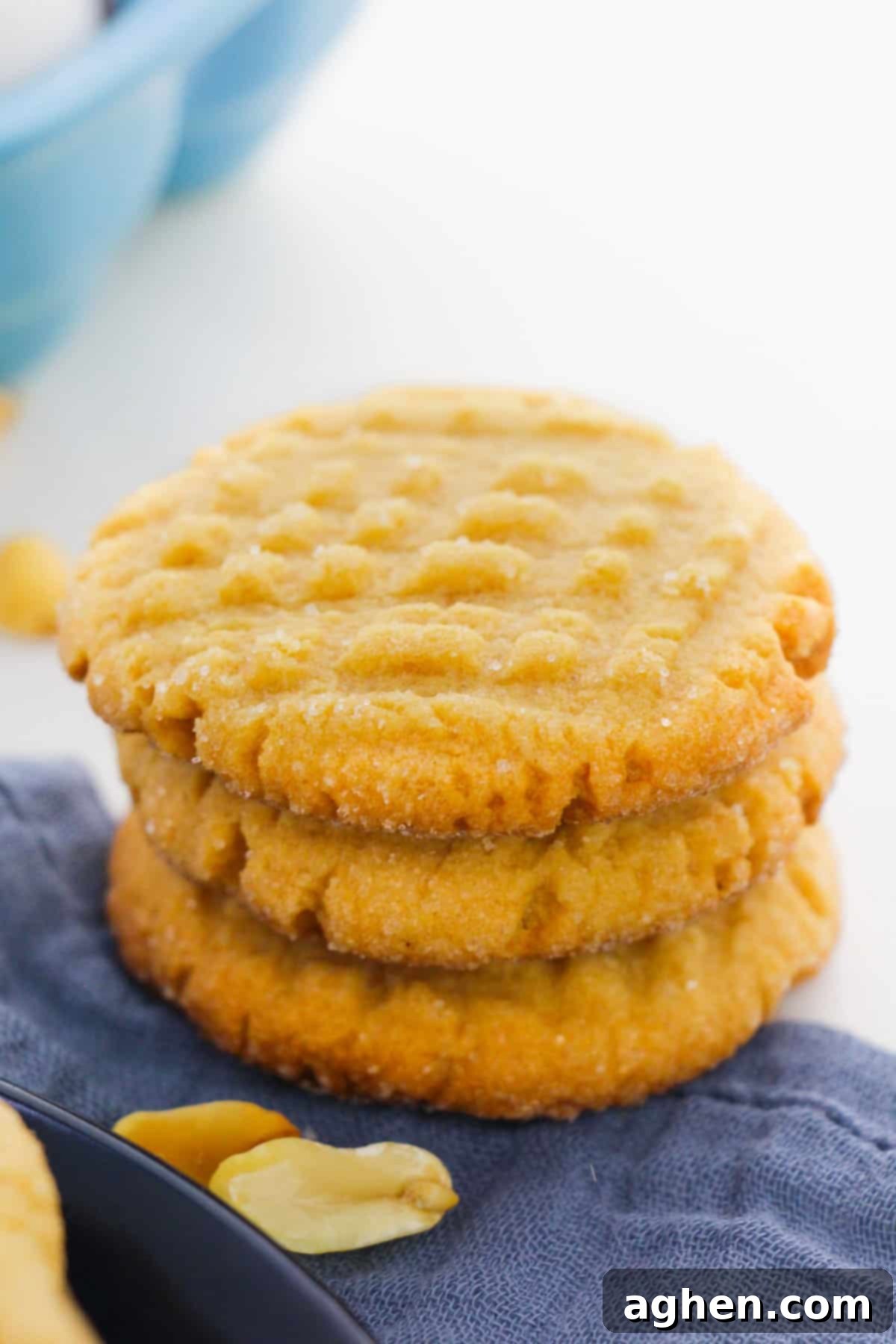 Stack of three peanut butter cookies.