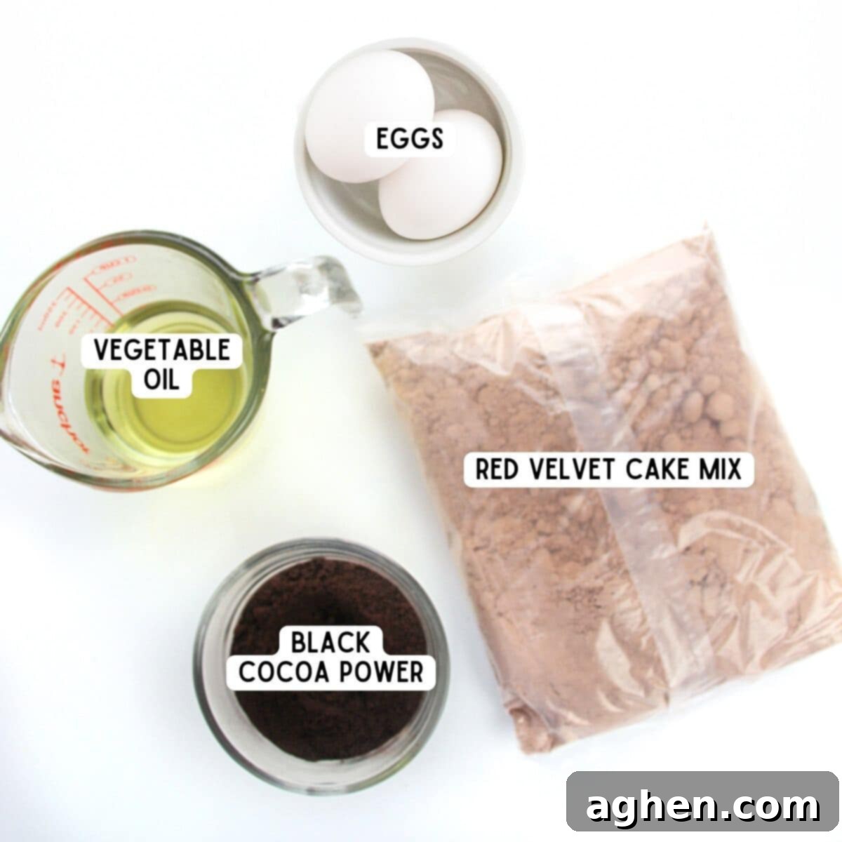 Devil's Delights 4 Ingredients for easy Brimstone Cookies: a box of red velvet cake mix, black cocoa powder, two eggs, and a bottle of vegetable oil displayed on a rustic wooden surface.