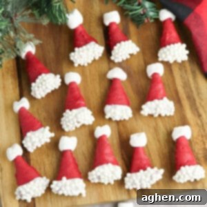 Bugle Santa Hats - Bugles dipped in red chocolate and decorated with white sprinkles and mini marshmallows to look like santa hats.