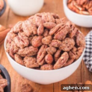Candied pecans and almonds in a white bowl.