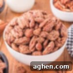 Candied pecans and almonds in a white bowl.
