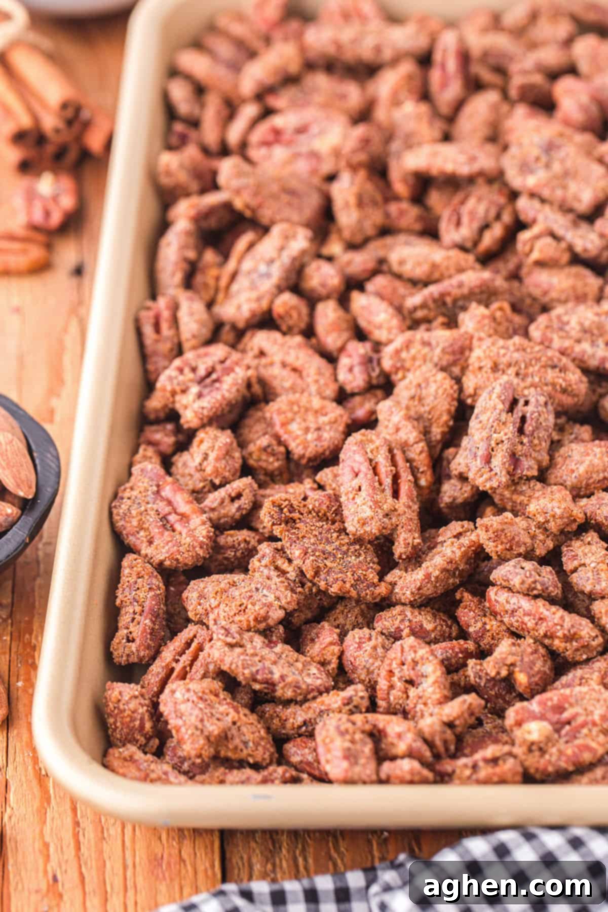 Candied almonds and pecans cooling on a baking sheet, ready to be enjoyed.