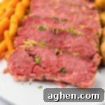 Tender and juicy crockpot corned beef brisket with baby potatoes and carrots.