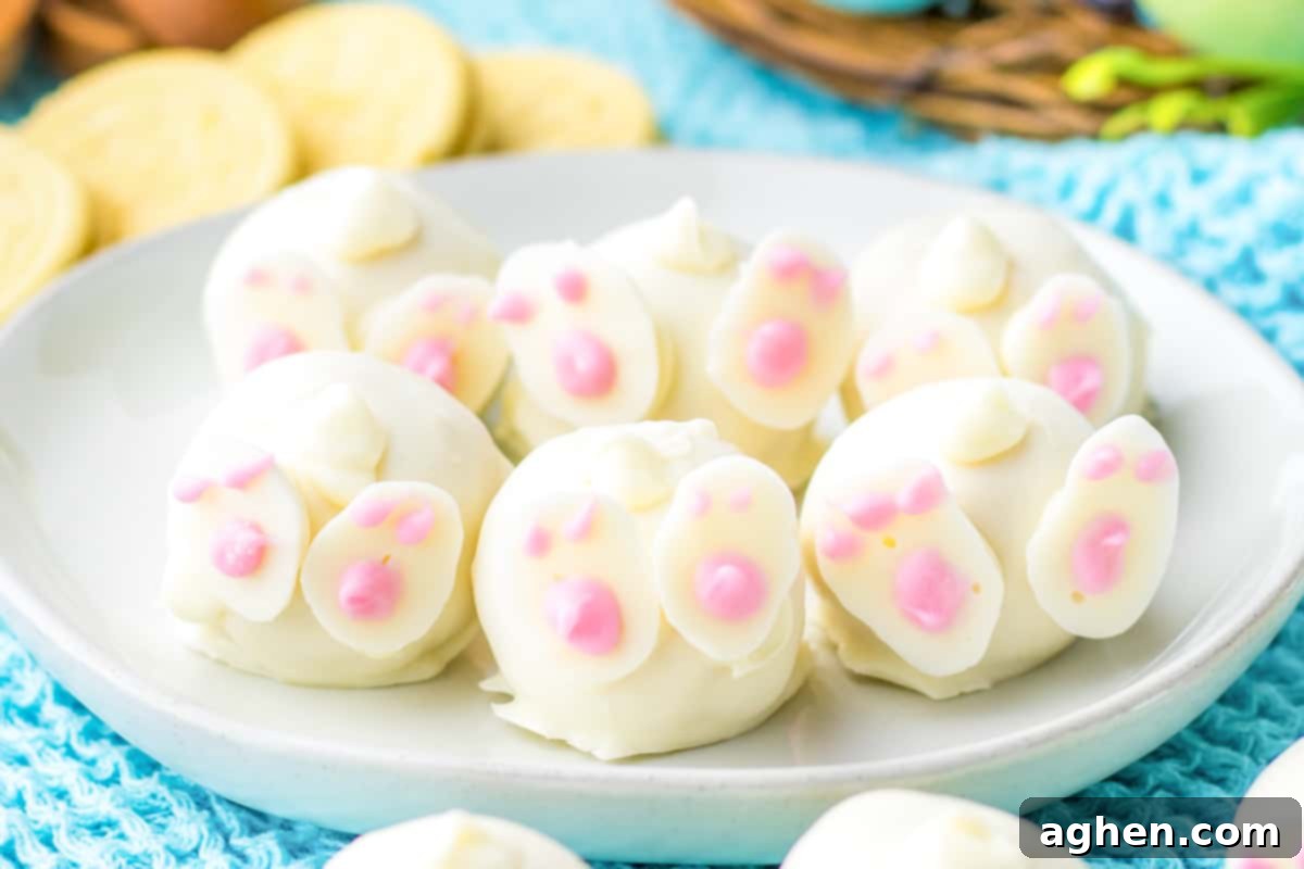 A charming close-up of Bunny Butt Oreo truffles, meticulously crafted with bright lemon Oreo cookies, perfect for an Easter celebration. The details of the white chocolate coating and pink feet are highlighted.
