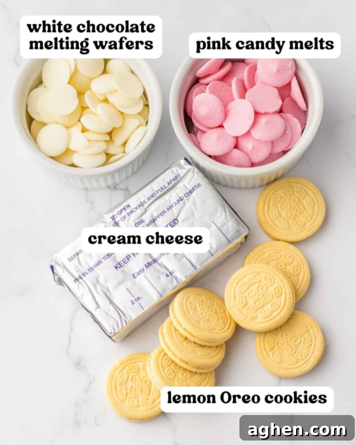 A vibrant flat lay of key ingredients for Bunny Butt Truffles, featuring white chocolate melting wafers, softened cream cheese, pink candy melts, and bright lemon Oreo cookies.