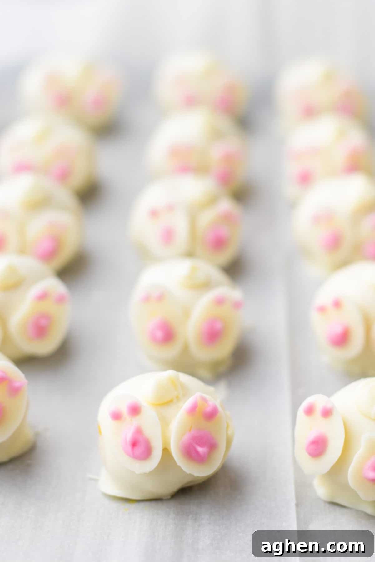 Finished Easter Oreo balls, charmingly decorated with cute bunny feet and whimsical tails, perfectly resembling bunny butts.