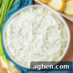 Creamy Knorr Spinach Dip 11 Cold and creamy Knorr spinach dip served with sliced bread pieces for dipping.